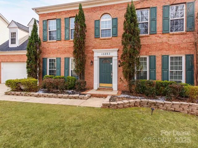 a view of a house with a swimming pool