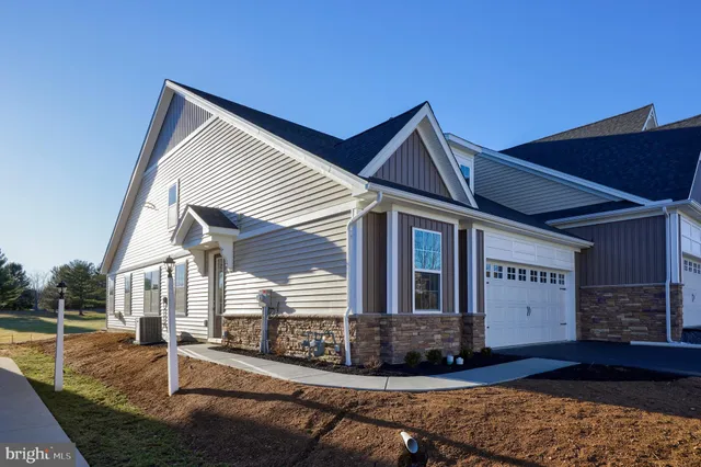 a view of house with yard