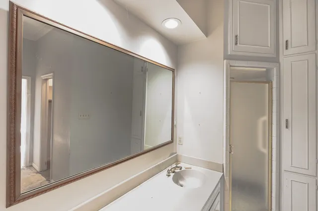 a bathroom with a sink and a mirror