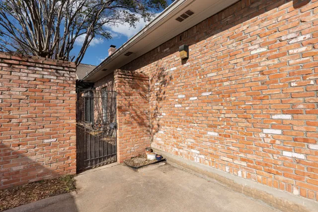 a porch with swimming pool in front of house