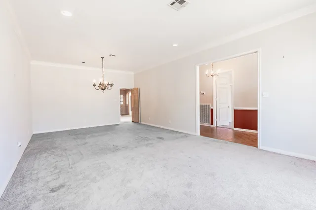 a view of a big room with a ceiling fan