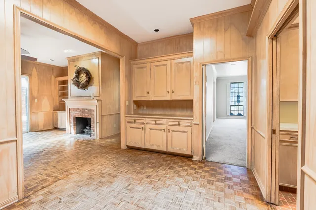 a view of a kitchen with a sink and a fireplace