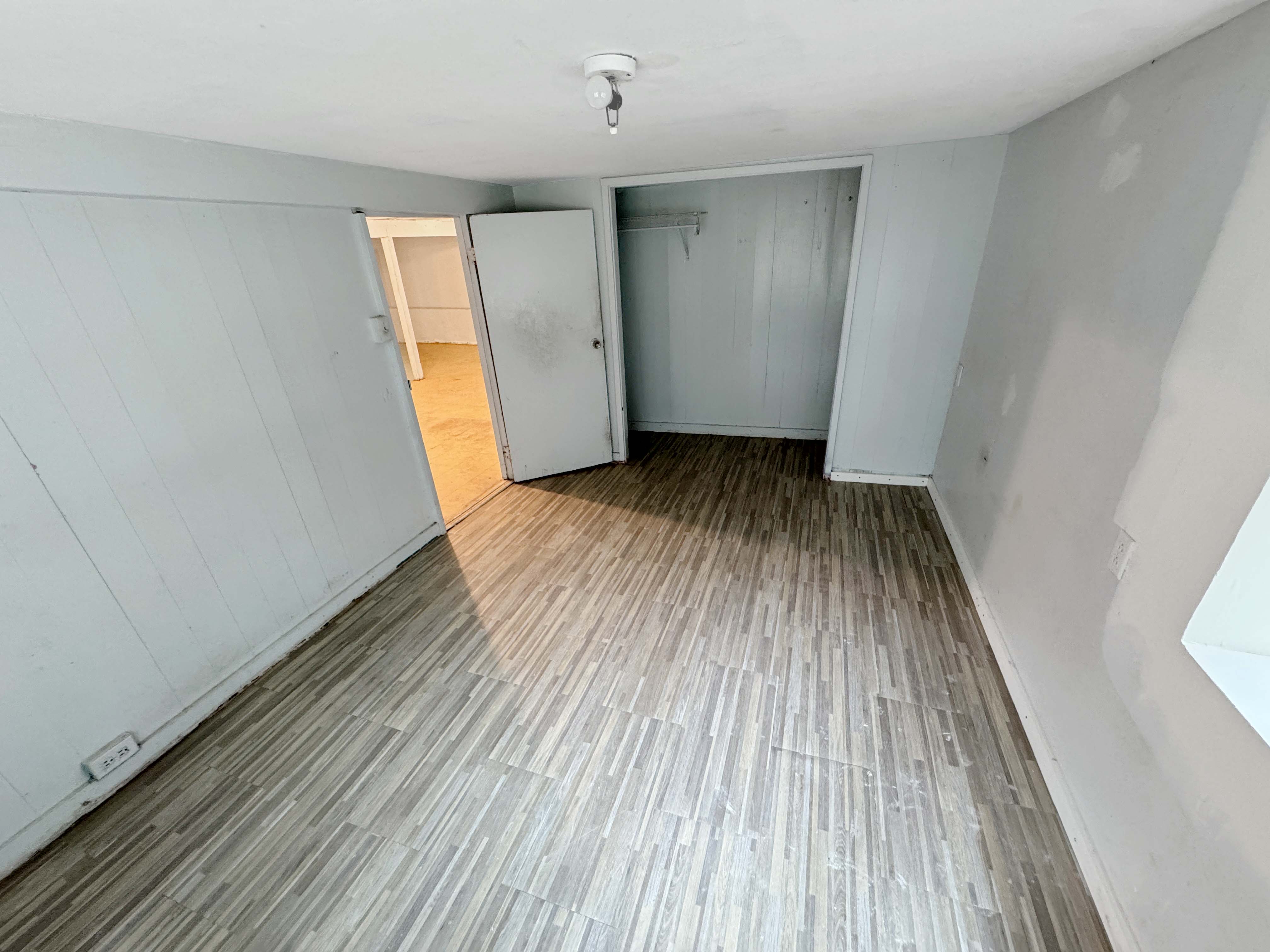 17-312 Volcano Road Kurtistown, HI 96749 - Photo 20 of 25 wooden floor in an empty room with a window