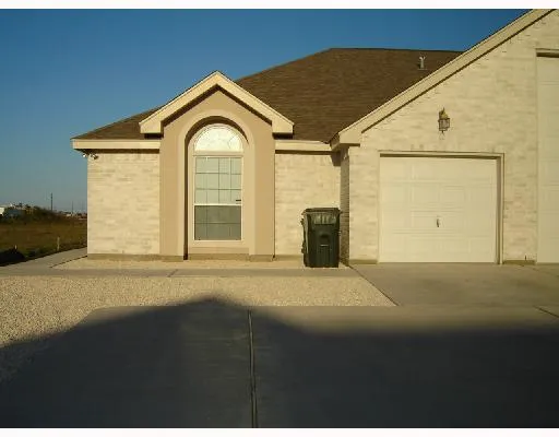 a view of a house with a snow in front of it