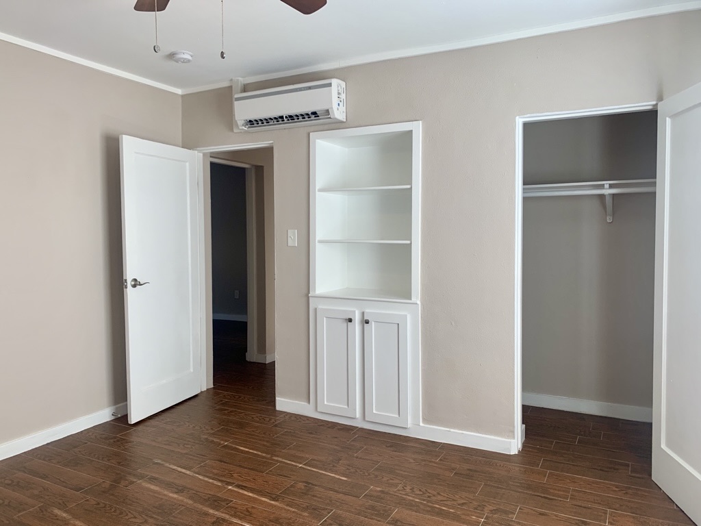1409 Kirkwood Road, Unit A Austin, TX 78722 - Photo 10 of 15 a view of an empty room with wooden floor