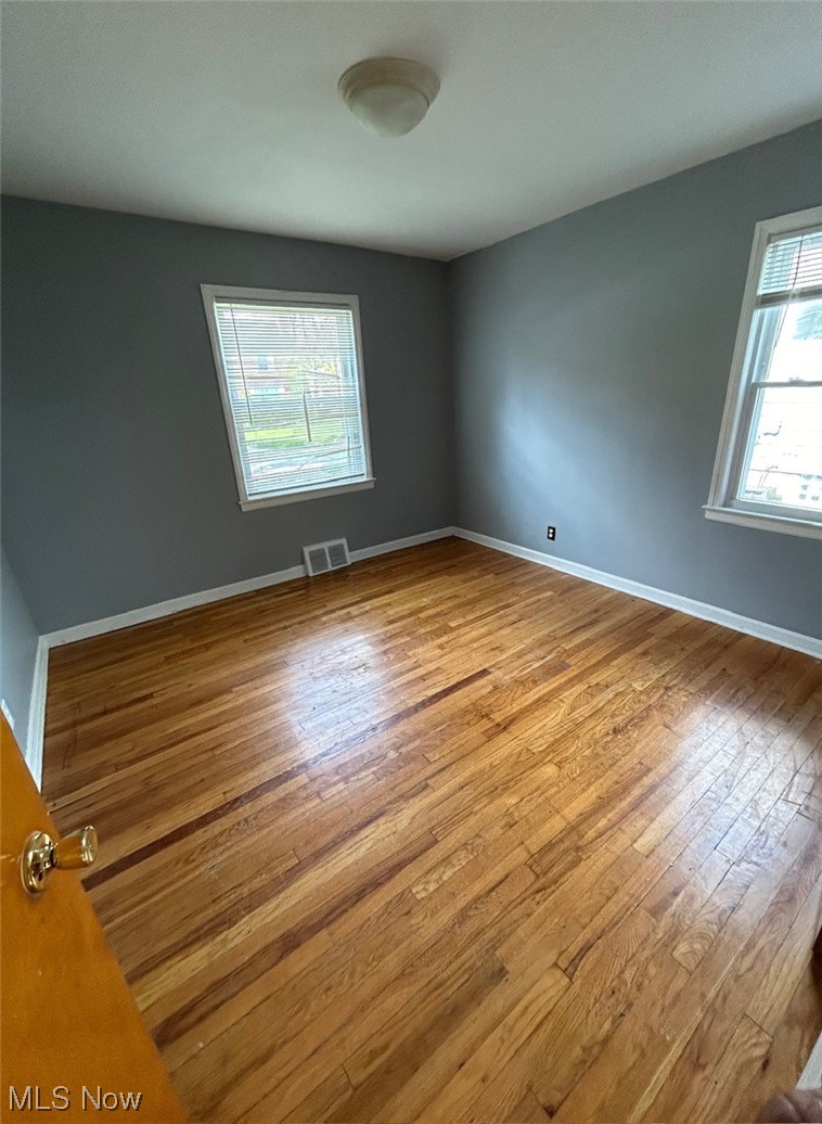 1287 Churchill Road Lyndhurst, OH 44124 - Photo 13 of 27 Empty room featuring plenty of natural light and light wood-type flooring
