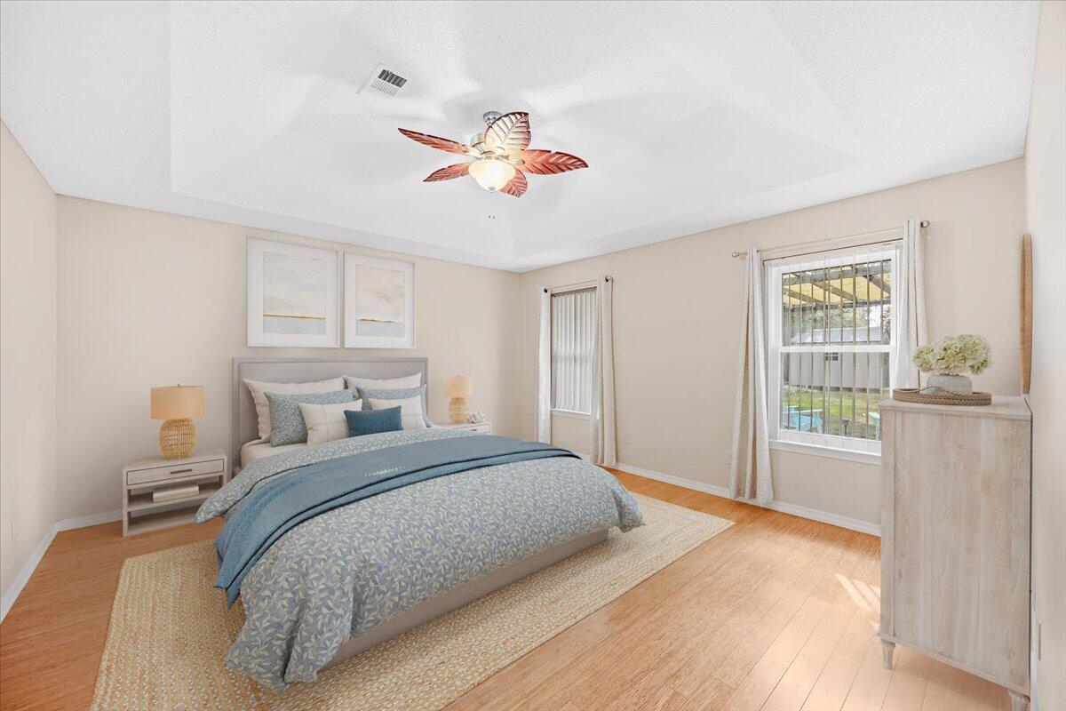 7807 Lola Circle Navarre, FL 32566 - Photo 21 of 45 a bedroom with a bed and a window