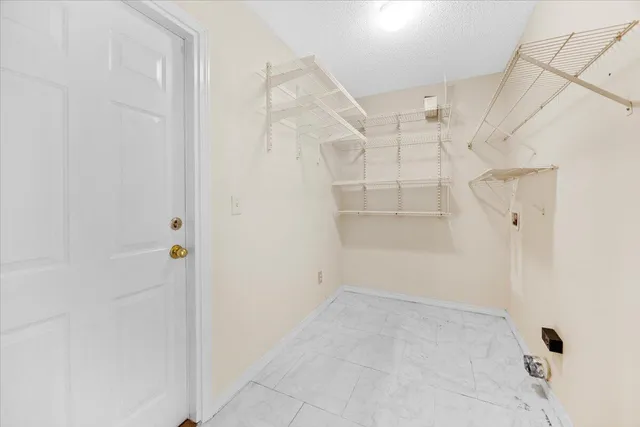 an aerial view of a house with a lake view