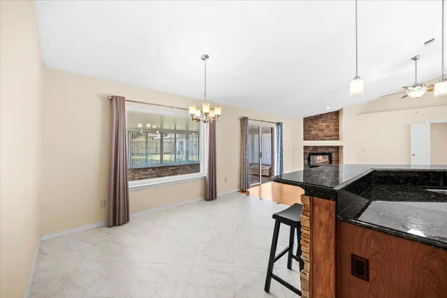 an aerial view of residential house with outdoor space and lake view