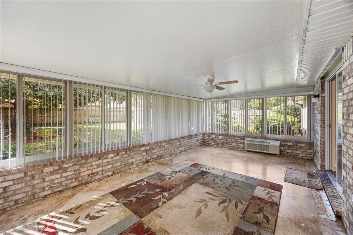 7807 Lola Circle Navarre, FL 32566 - Photo 33 of 45 a view of a spacious bedroom with a large window