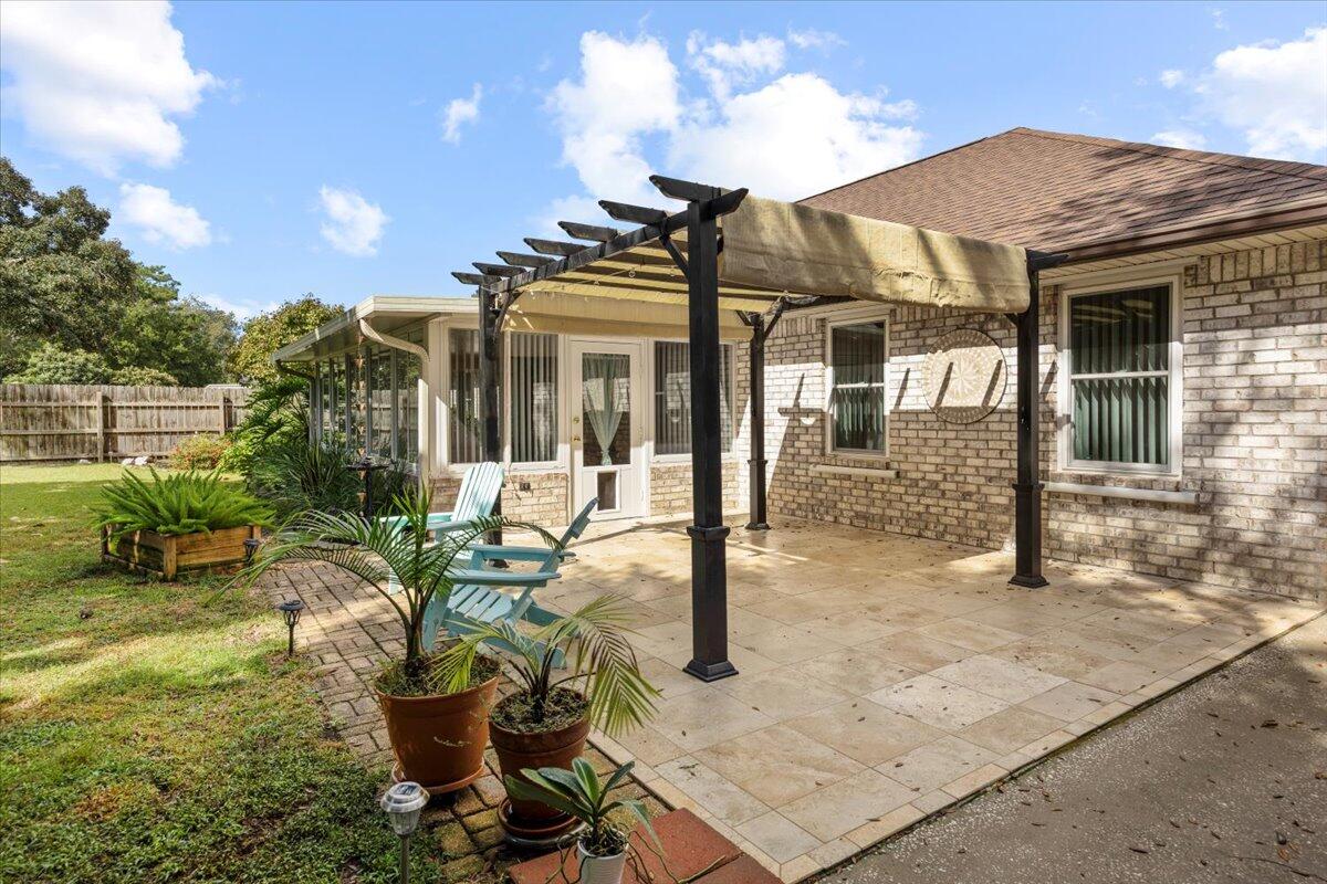 7807 Lola Circle Navarre, FL 32566 - Photo 39 of 45 a view of a house with backyard and sitting area