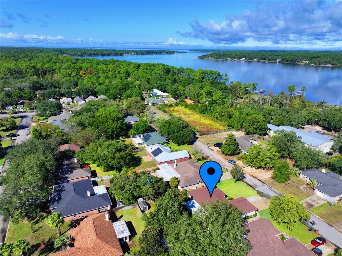7807 Lola Circle Navarre, FL 32566 - Photo 41 of 45 an aerial view of residential house with outdoor space and lake view