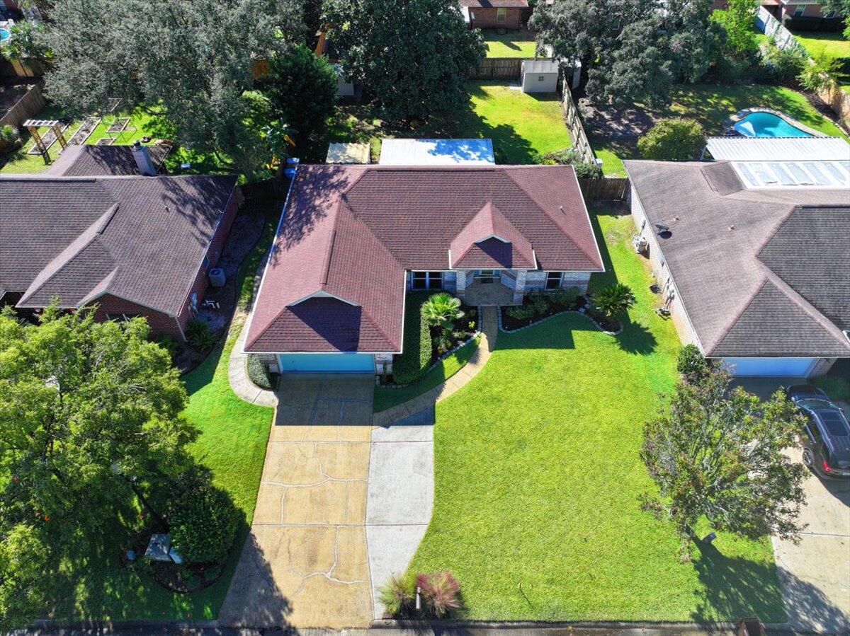 7807 Lola Circle Navarre, FL 32566 - Photo 44 of 45 an aerial view of a house with swimming pool and large trees