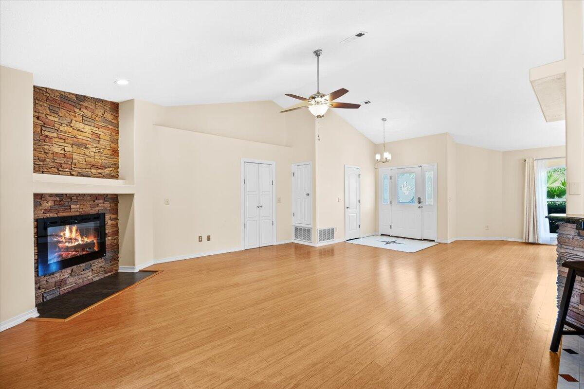 7807 Lola Circle Navarre, FL 32566 - Photo 8 of 45 a view of an empty room with fire place and a fireplace