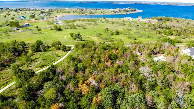 a view of a swimming pool and a yard