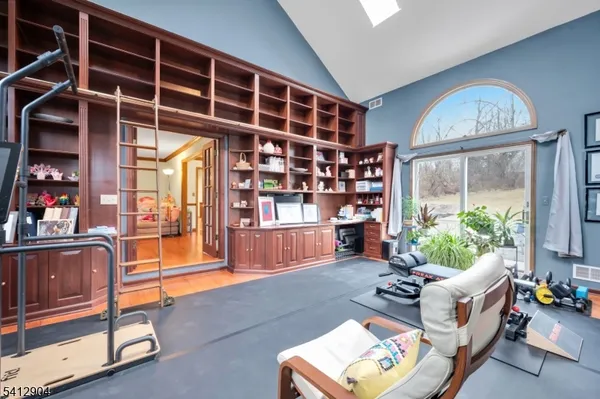 a living room with furniture a rug and a window