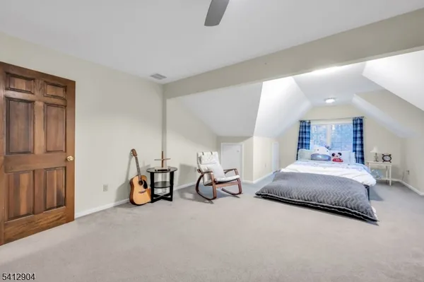 a bedroom with bed and window