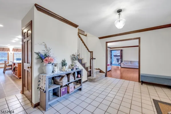 a bedroom with furniture and a potted plant
