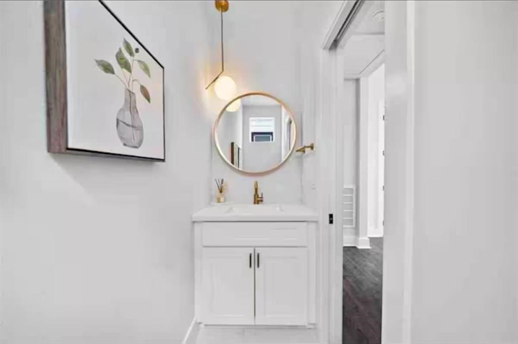 3610 Dreyfus Street, Unit A Houston, TX 77021 - Photo 16 of 20 a bathroom with a sink mirror and vanity