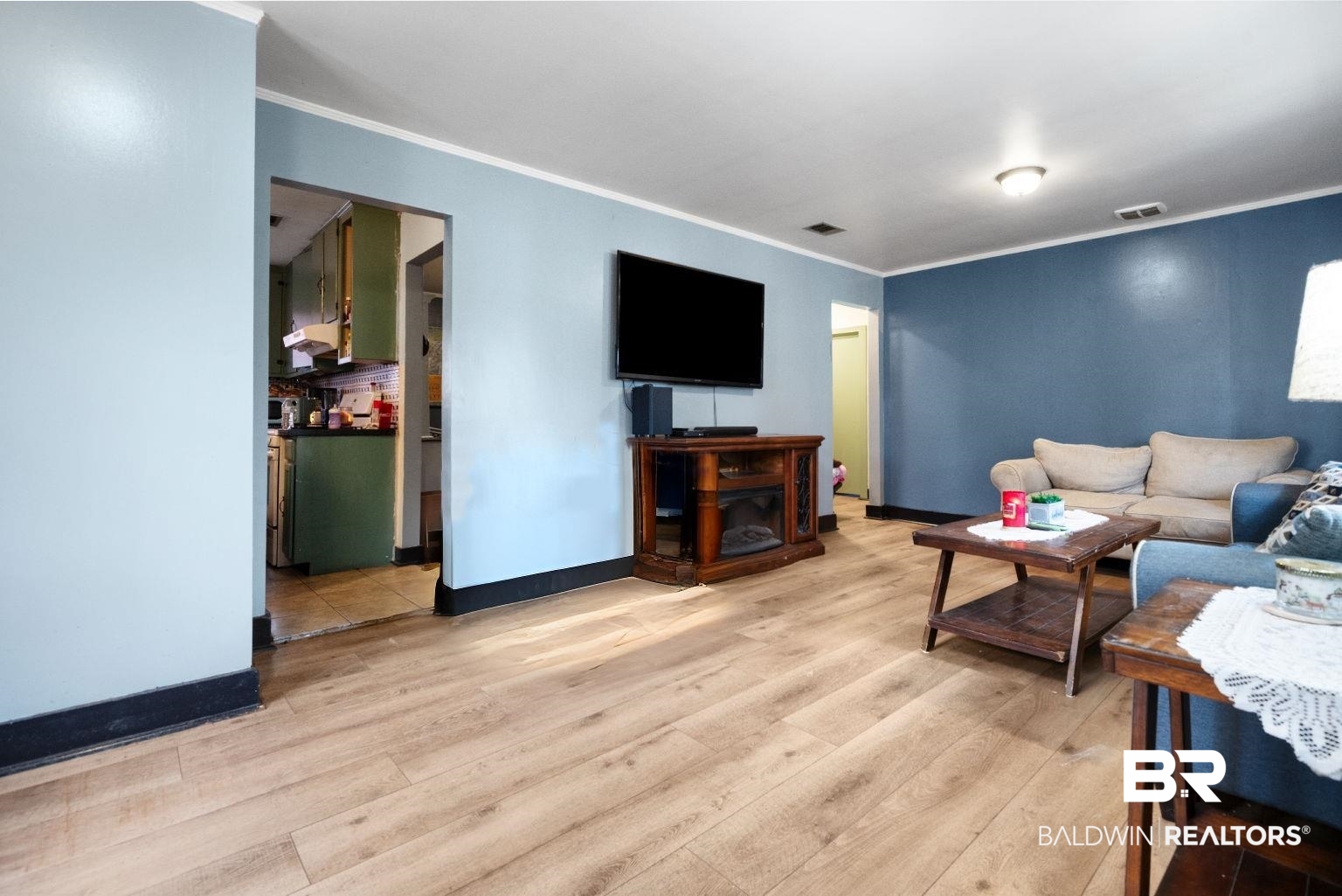 305 Alpine Street Mobile, AL 36611 - Photo 5 of 21 Living room with ornamental molding and light wood-type flooring