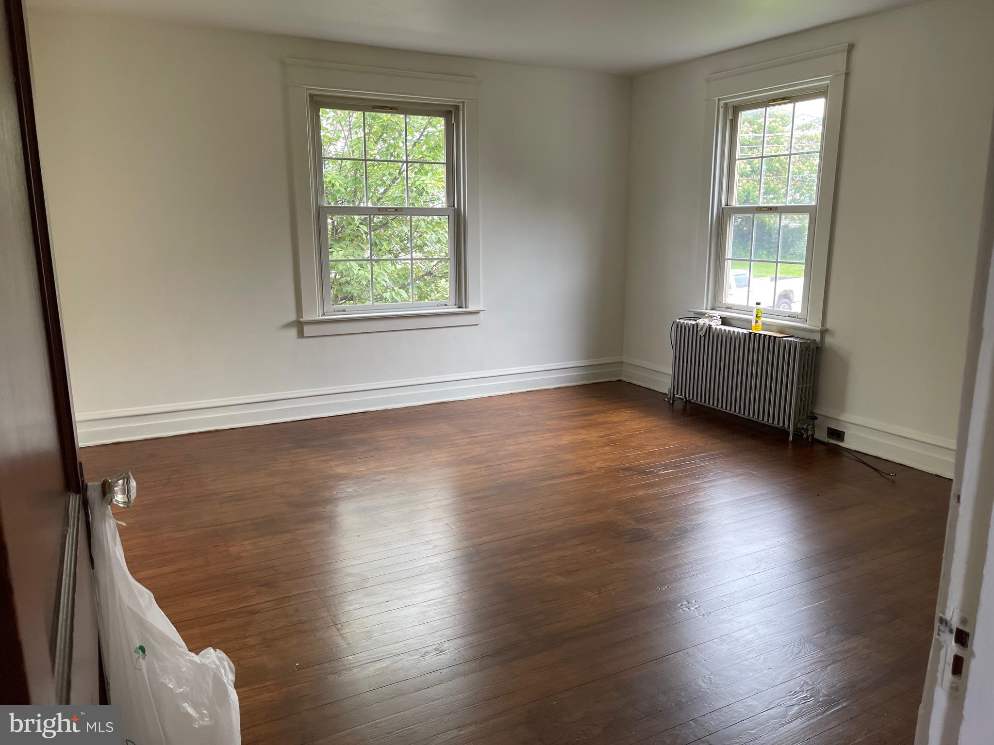 1083 Georgetown Road Paradise, PA 17562 - Photo 8 of 14 an empty room with wooden floor and windows