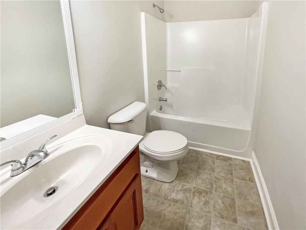 189 Hampton Drive Jefferson, GA 30549 - Photo 29 of 36 a bathroom with a sink a toilet and shower