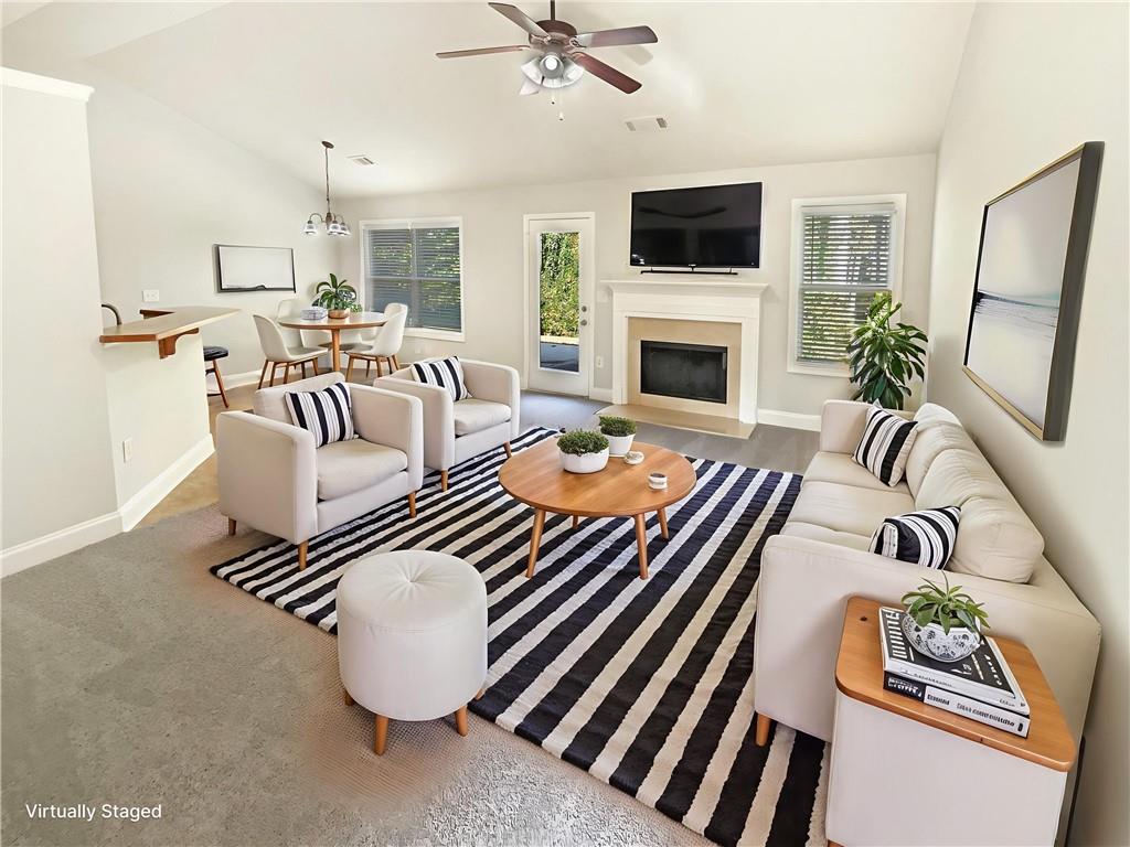 189 Hampton Drive Jefferson, GA 30549 - Photo 5 of 36 a living room with furniture fireplace and flat screen tv