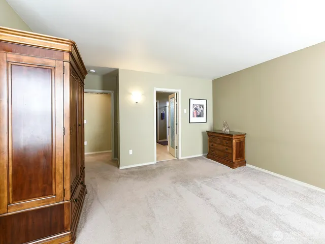 a view of an empty room with a bathroom