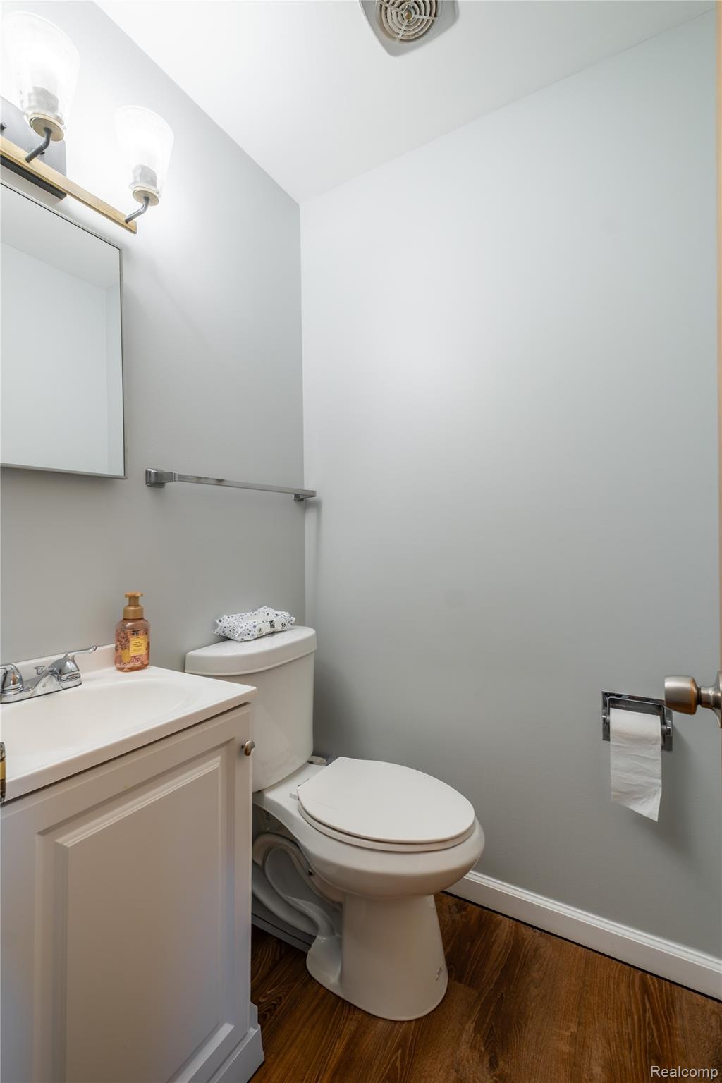 4240 Sheridan Road Flushing, MI 48433 - Photo 25 of 44 Bathroom with vanity and dark wood-style flooring