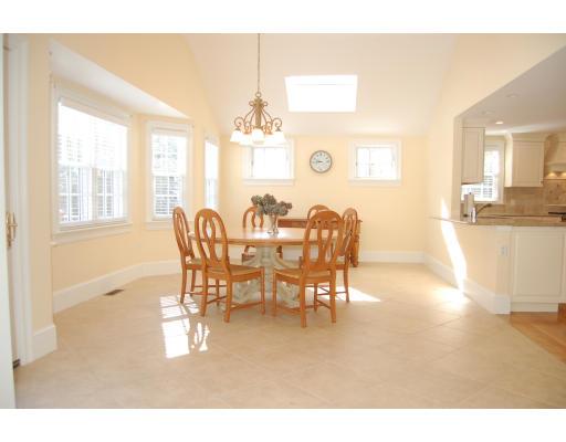 163 Hampshire Road Wellesley, MA 02481 - Photo 3 of 8 a view of a dining room with furniture and chandelier