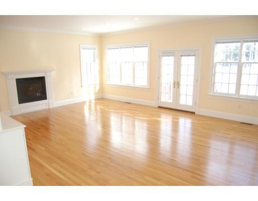 163 Hampshire Road Wellesley, MA 02481 - Photo 4 of 8 a view of an empty room with wooden floor and a window