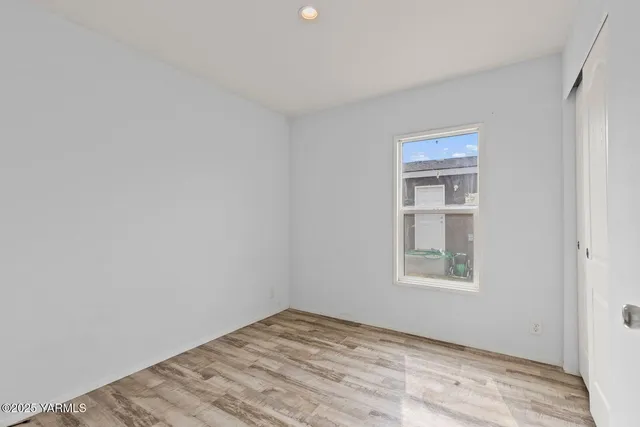 a view of empty room with windows