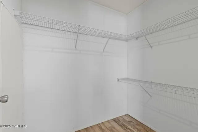 a view of a room with racks on the wall