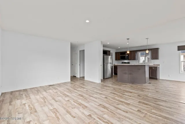 a view of kitchen with wooden floor