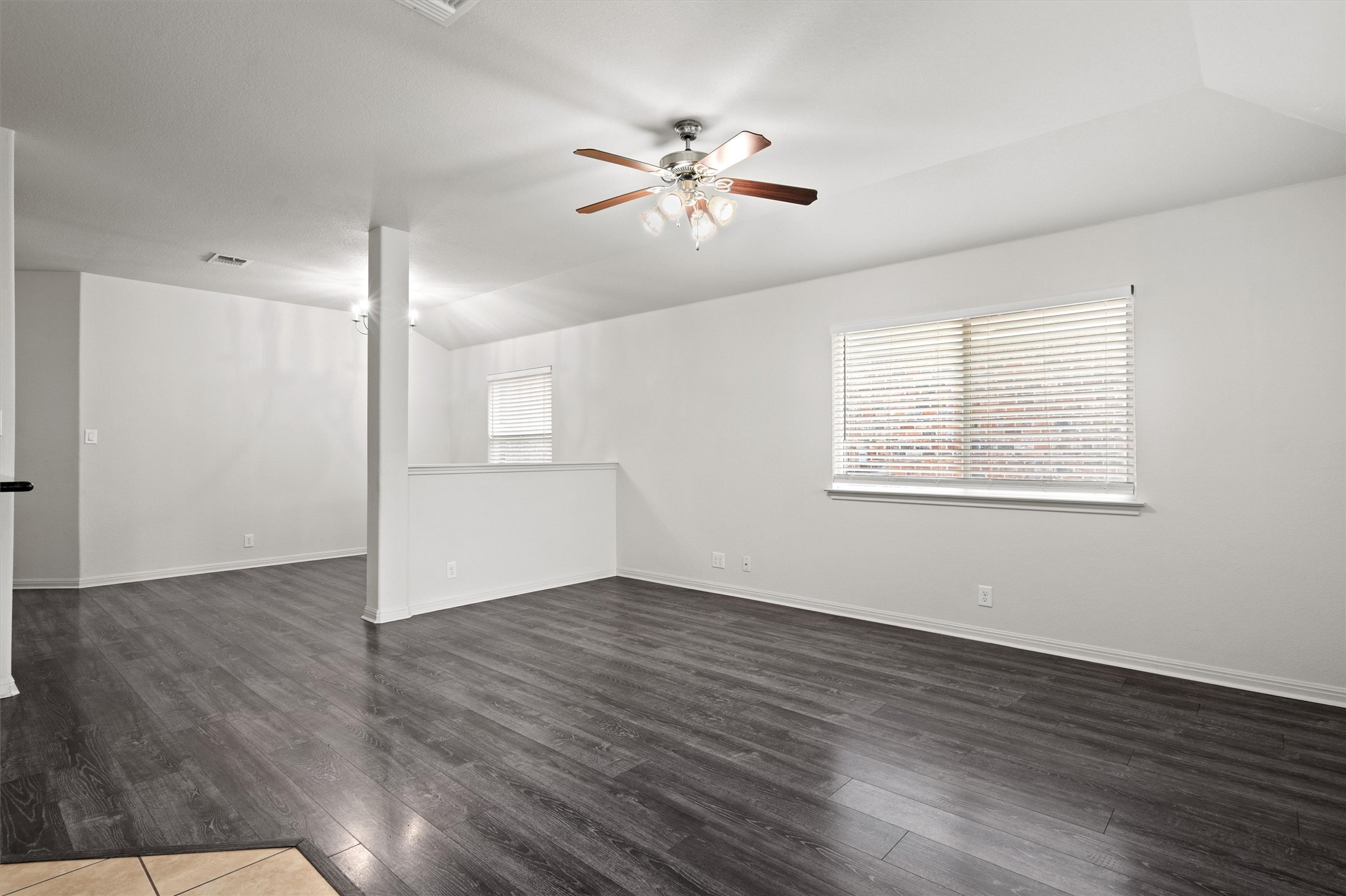1612 Musket Valley Trail Austin, TX 78754 - Photo 11 of 34 a view of an empty room with wooden floor and a window