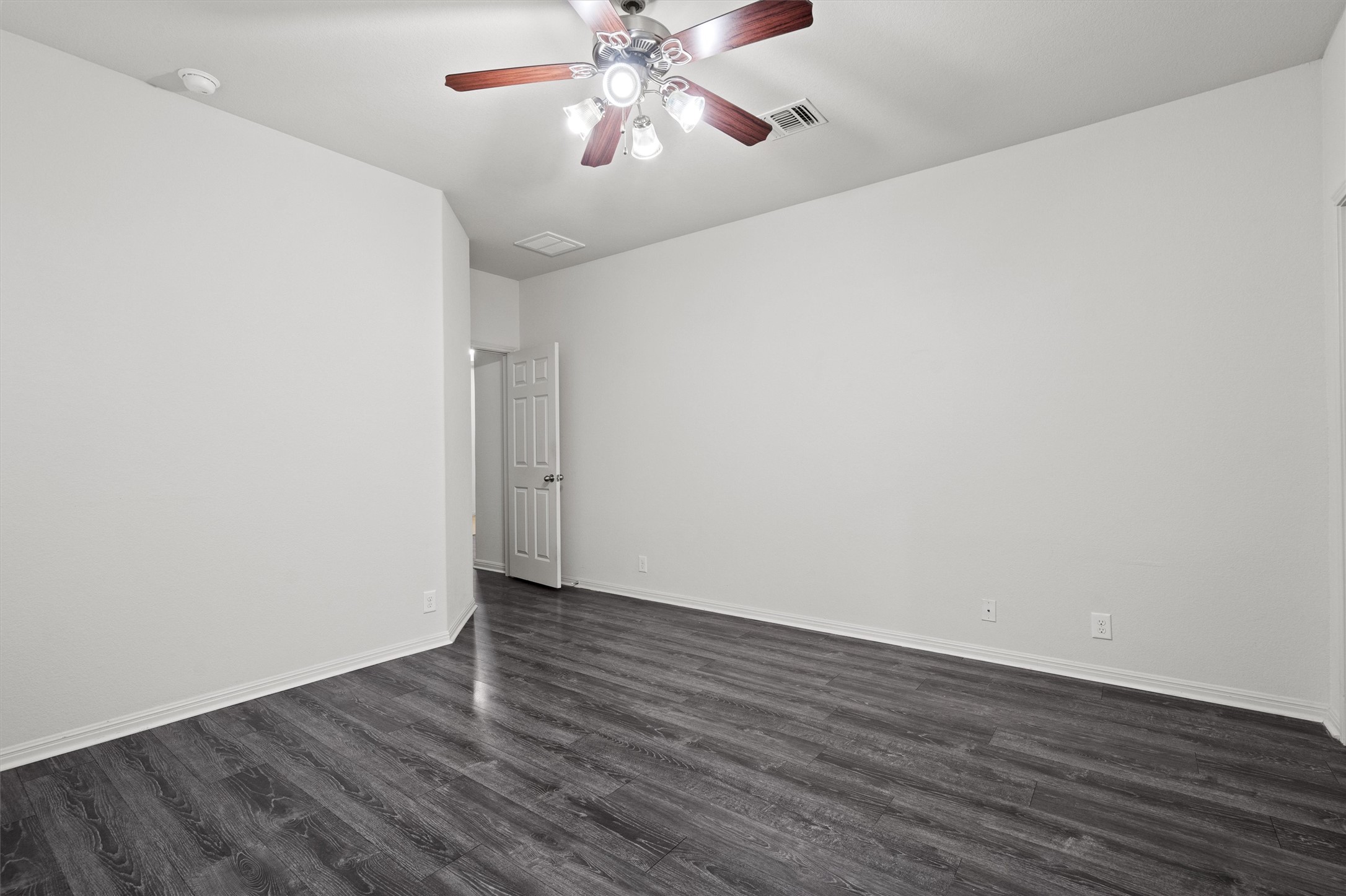 1612 Musket Valley Trail Austin, TX 78754 - Photo 20 of 34 a view of an empty room with wooden floor