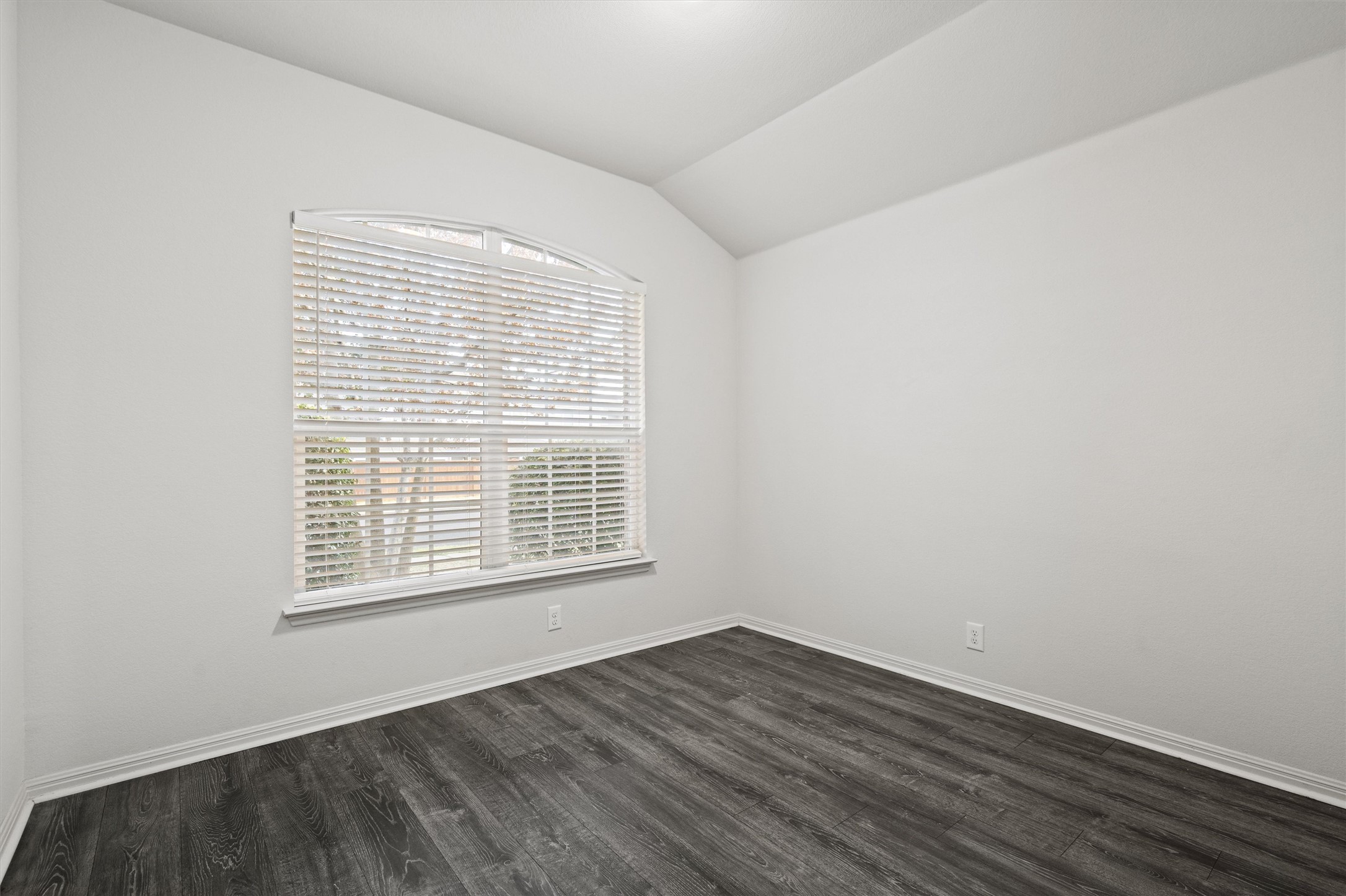 1612 Musket Valley Trail Austin, TX 78754 - Photo 24 of 34 a view of an empty room with wooden floor and a window