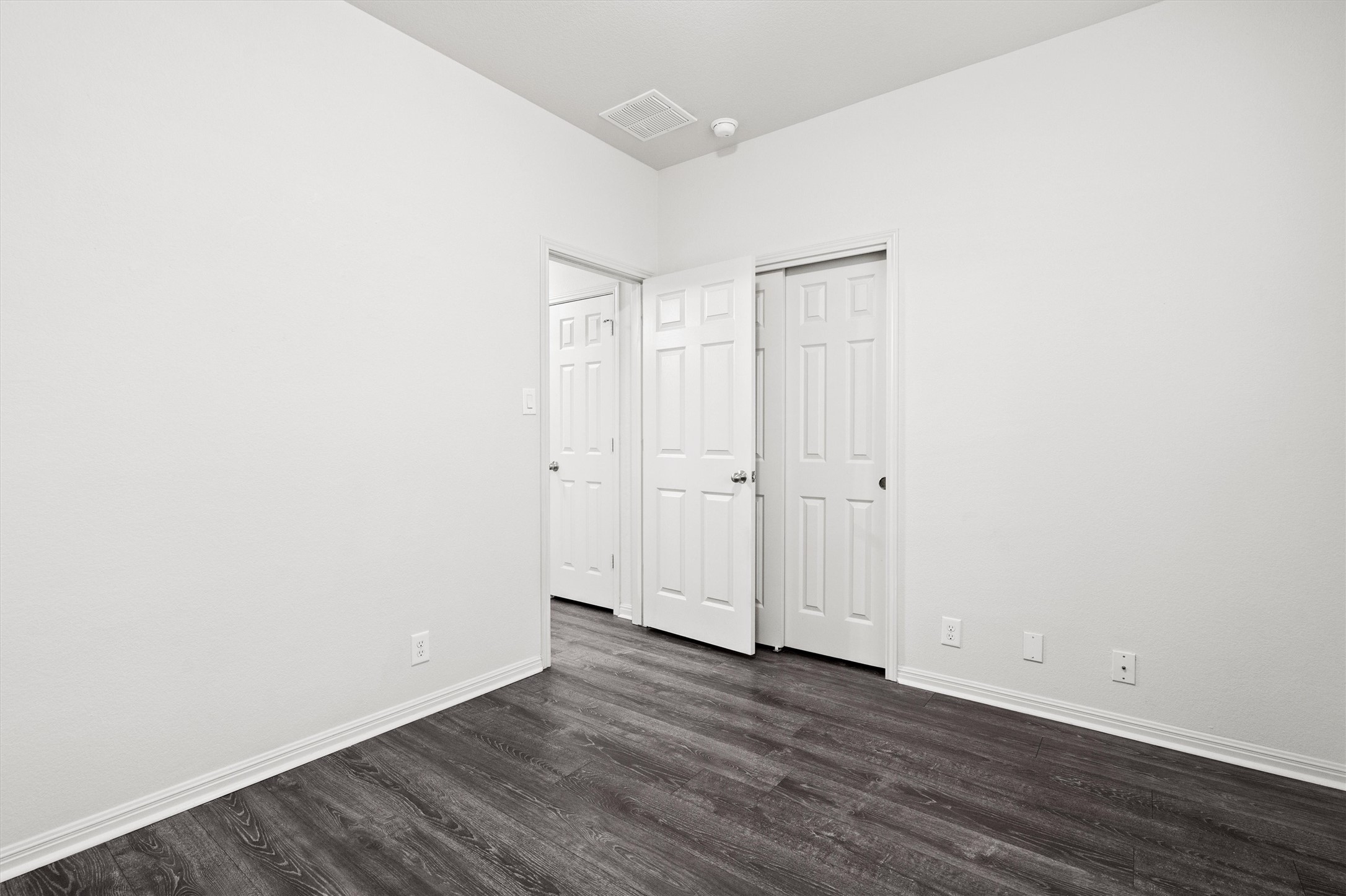 1612 Musket Valley Trail Austin, TX 78754 - Photo 25 of 34 a view of an empty room with wooden floor