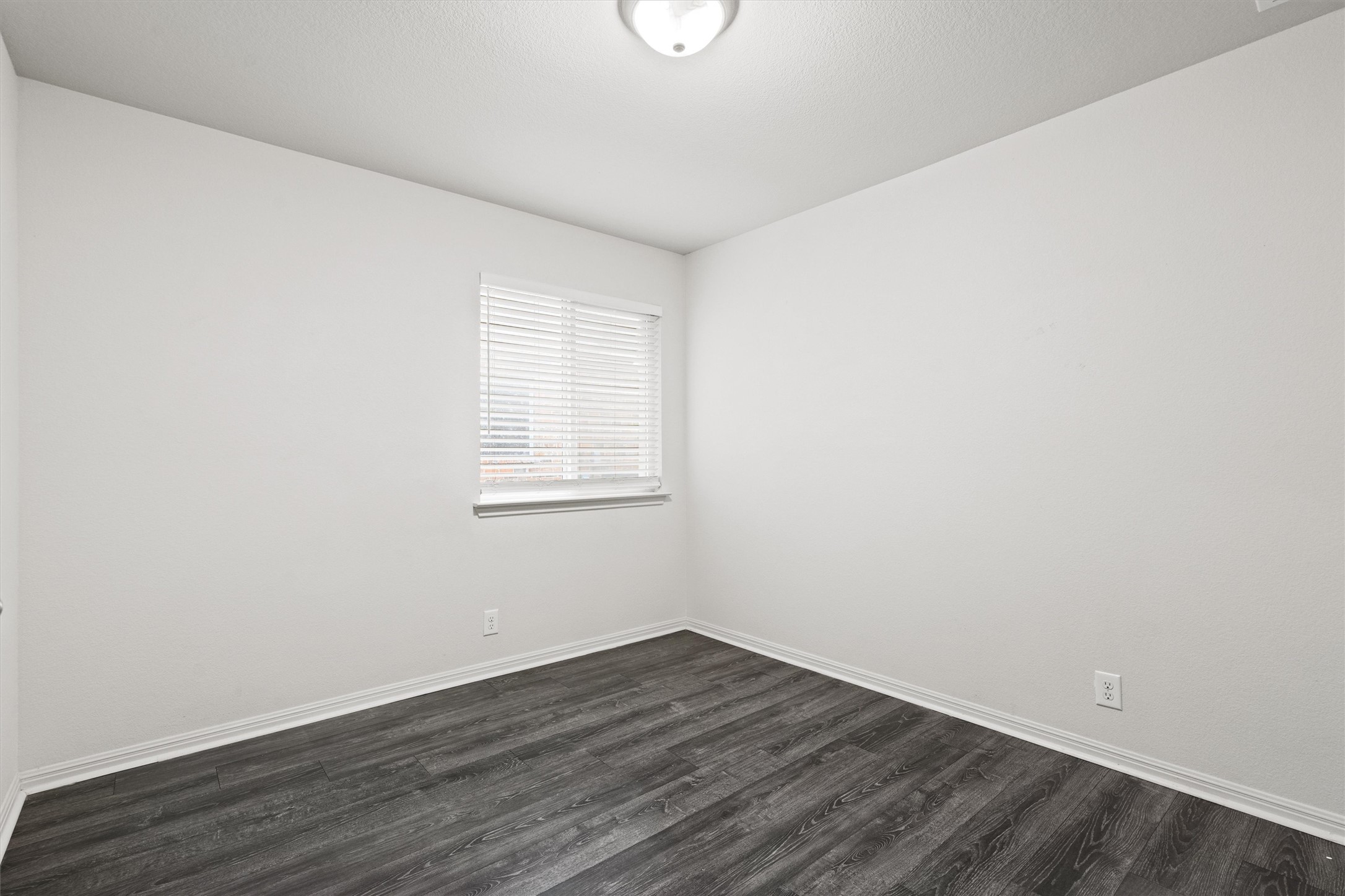 1612 Musket Valley Trail Austin, TX 78754 - Photo 26 of 34 an empty room with wooden floor and windows
