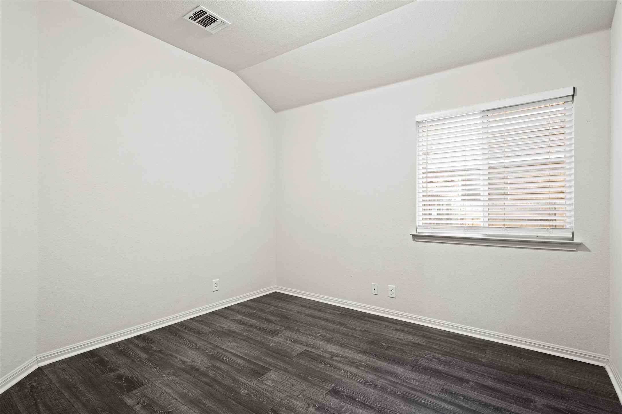 1612 Musket Valley Trail Austin, TX 78754 - Photo 28 of 34 wooden floor in an empty room with a window
