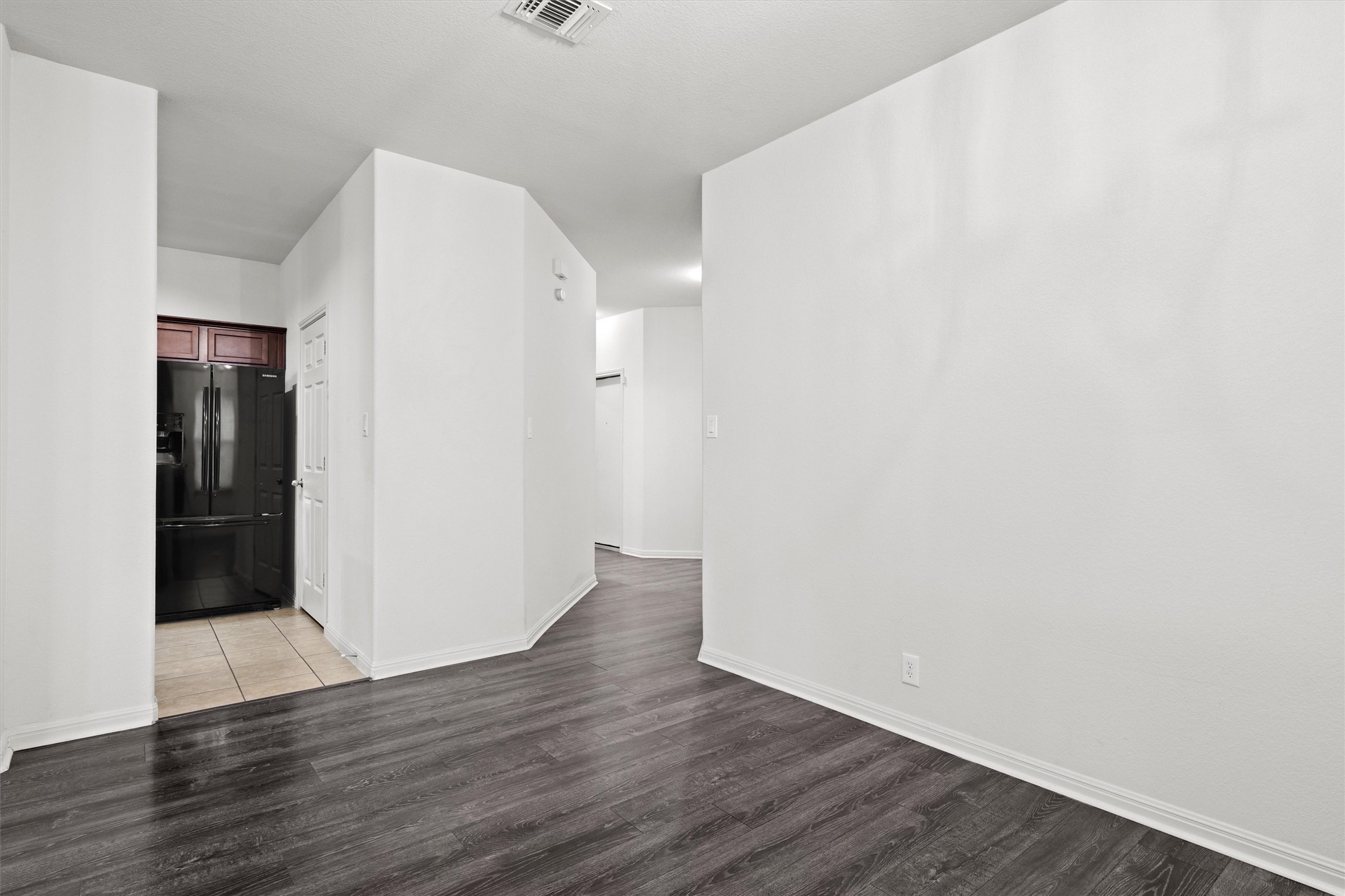 1612 Musket Valley Trail Austin, TX 78754 - Photo 8 of 34 a view of an empty room with wooden floor