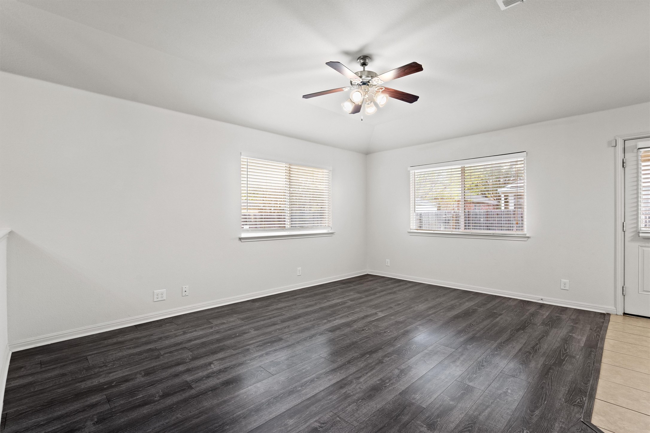 1612 Musket Valley Trail Austin, TX 78754 - Photo 9 of 34 a view of an empty room with wooden floor and a window