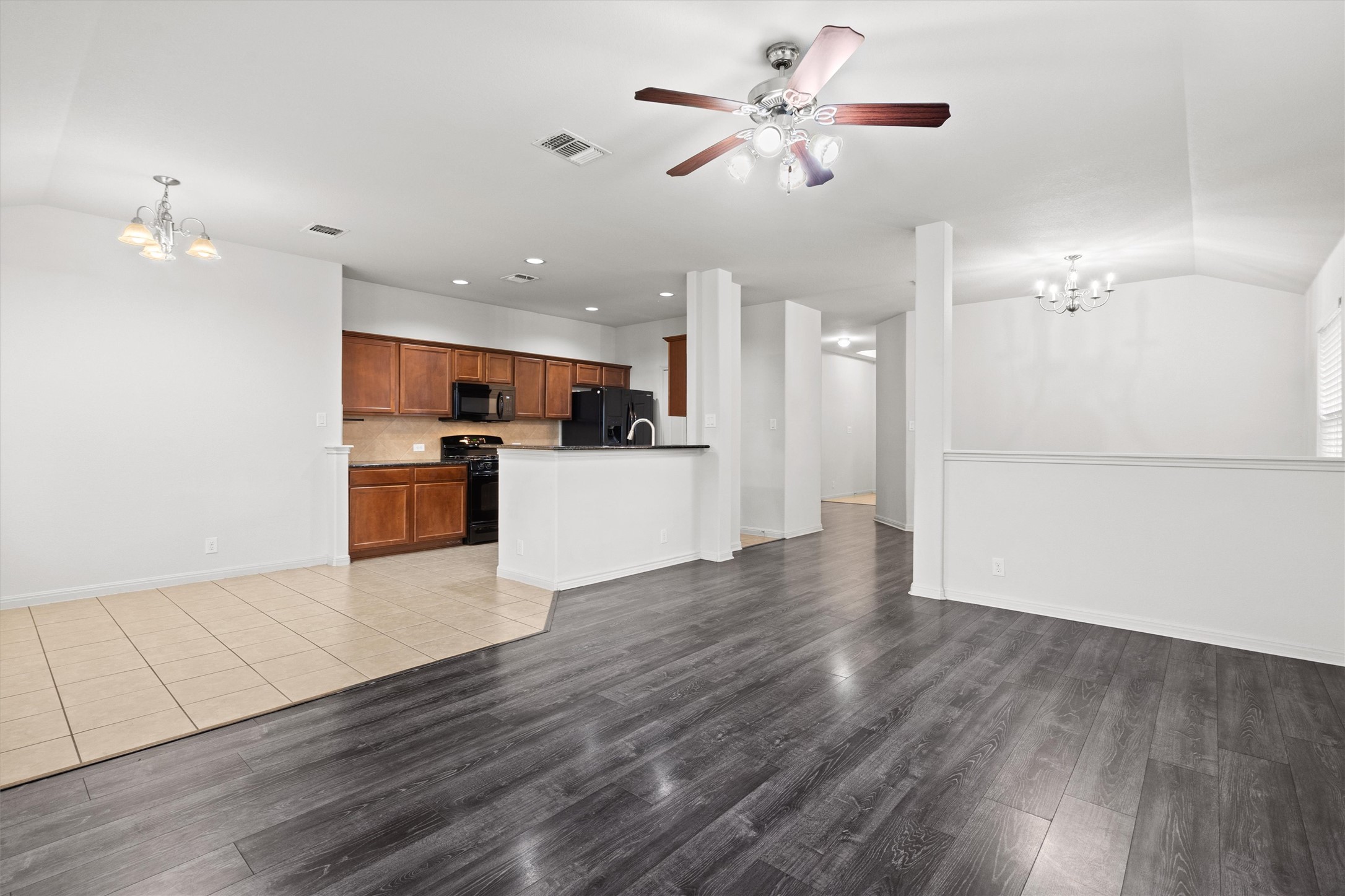 1612 Musket Valley Trail Austin, TX 78754 - Photo 10 of 34 a view of a kitchen with a sink and a refrigerator