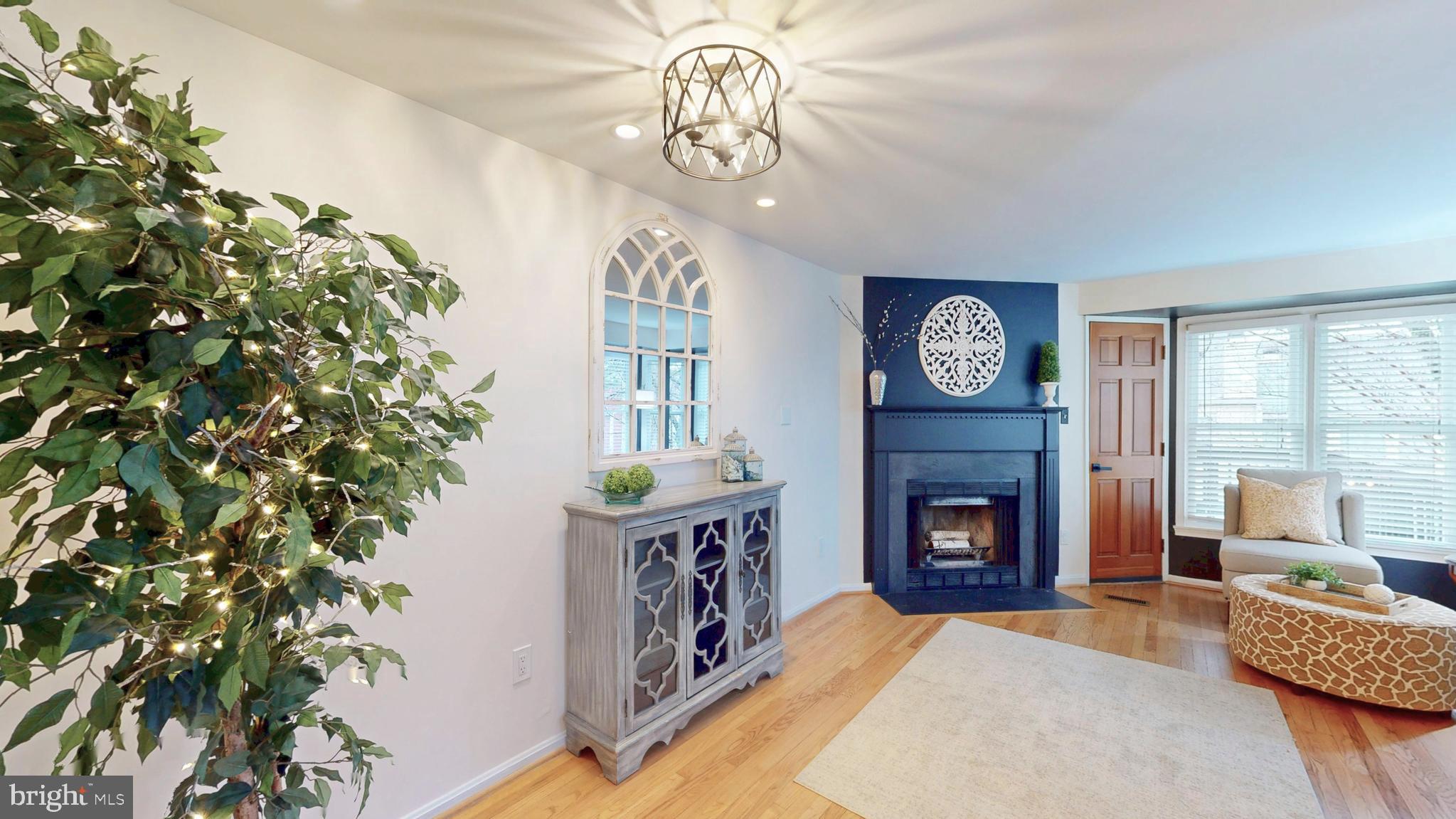 1771 Whisperhill Drive Reston, VA 20194 - Photo 14 of 44 a living room with furniture and a fireplace