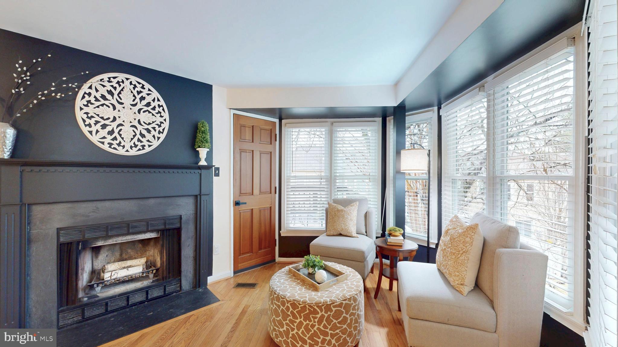 1771 Whisperhill Drive Reston, VA 20194 - Photo 15 of 44 a living room with furniture and a fireplace