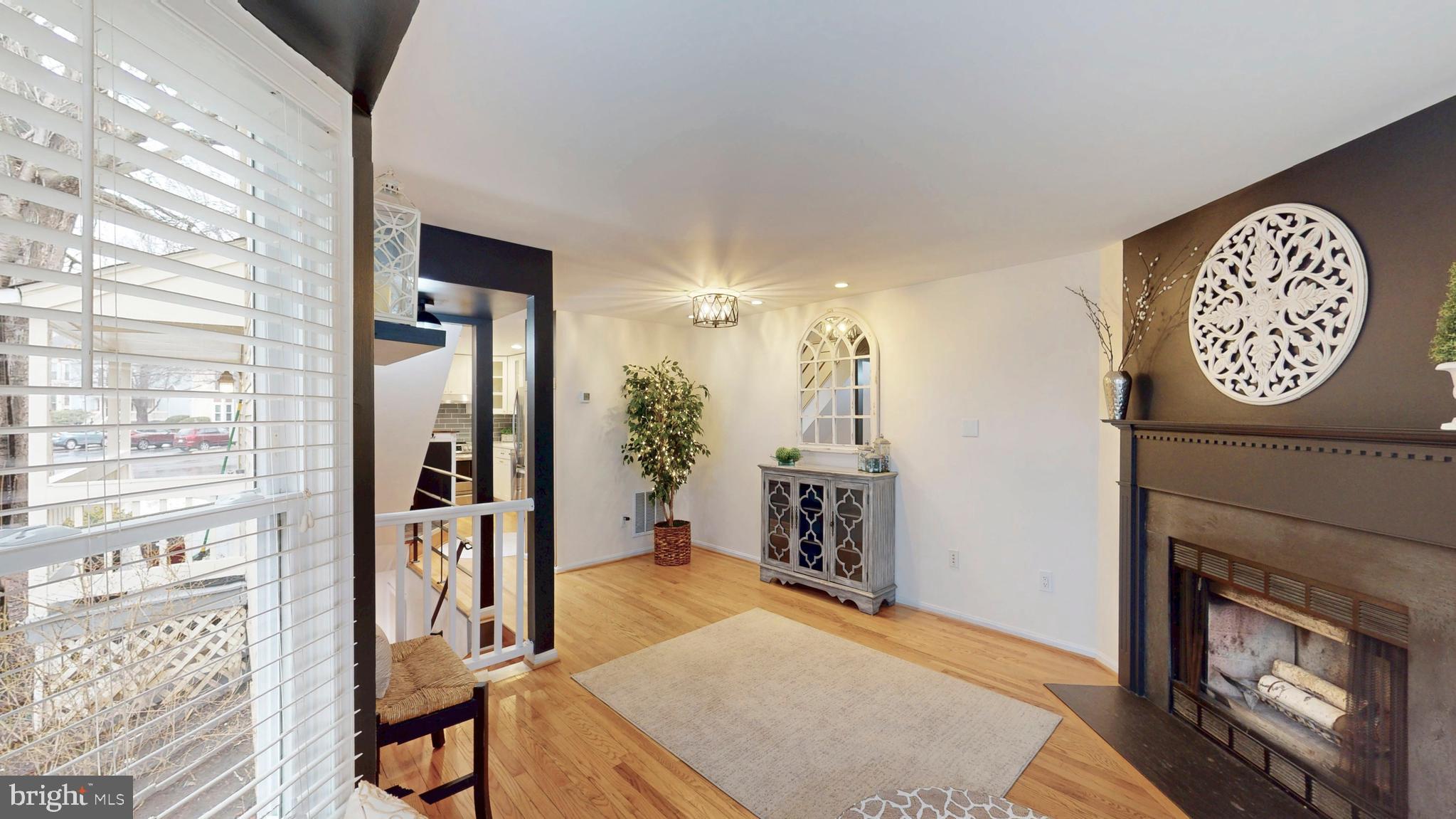 1771 Whisperhill Drive Reston, VA 20194 - Photo 16 of 44 a view of a livingroom with furniture and a fireplace