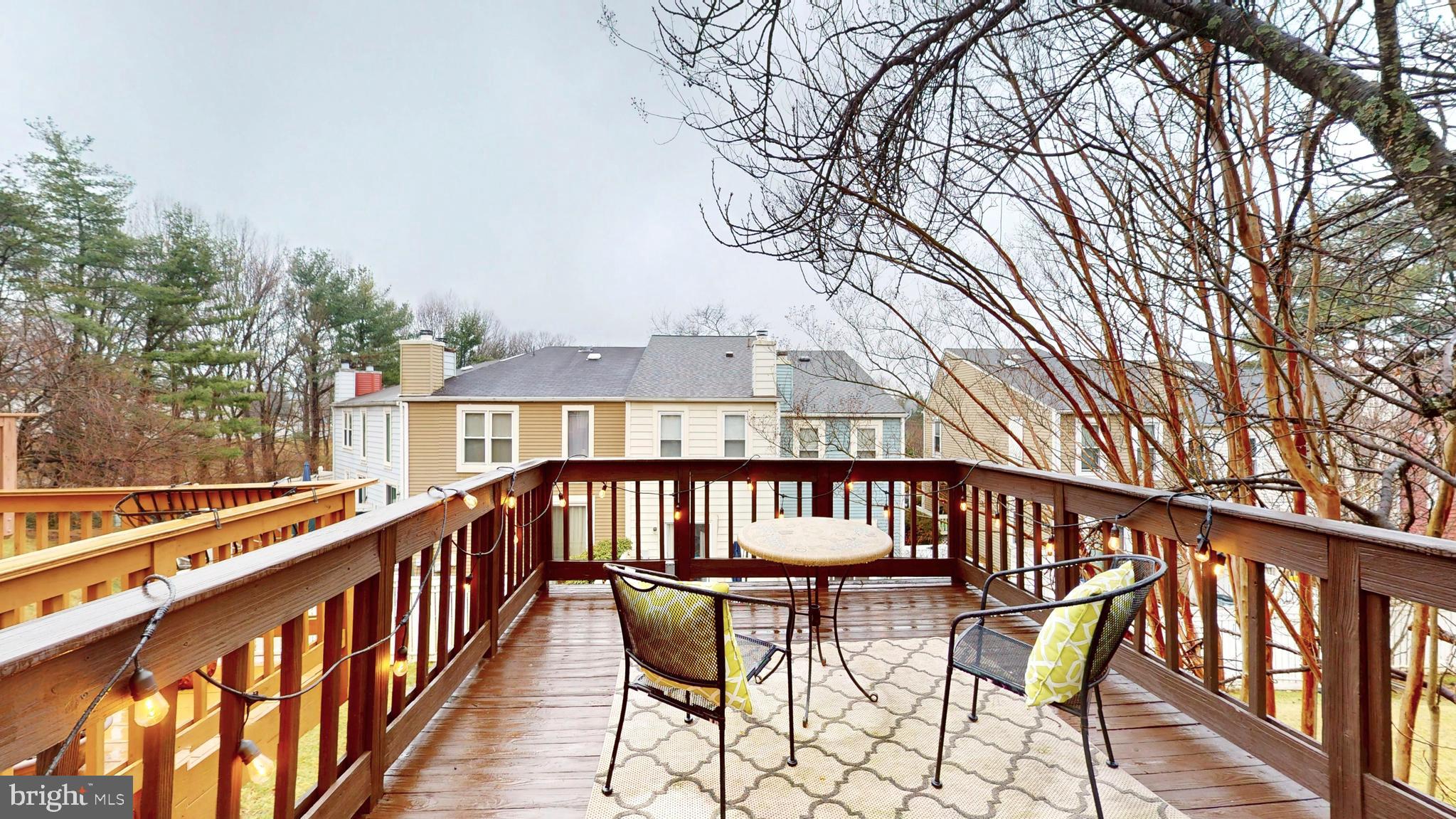 1771 Whisperhill Drive Reston, VA 20194 - Photo 18 of 44 a view of a chair and tables in the balcony
