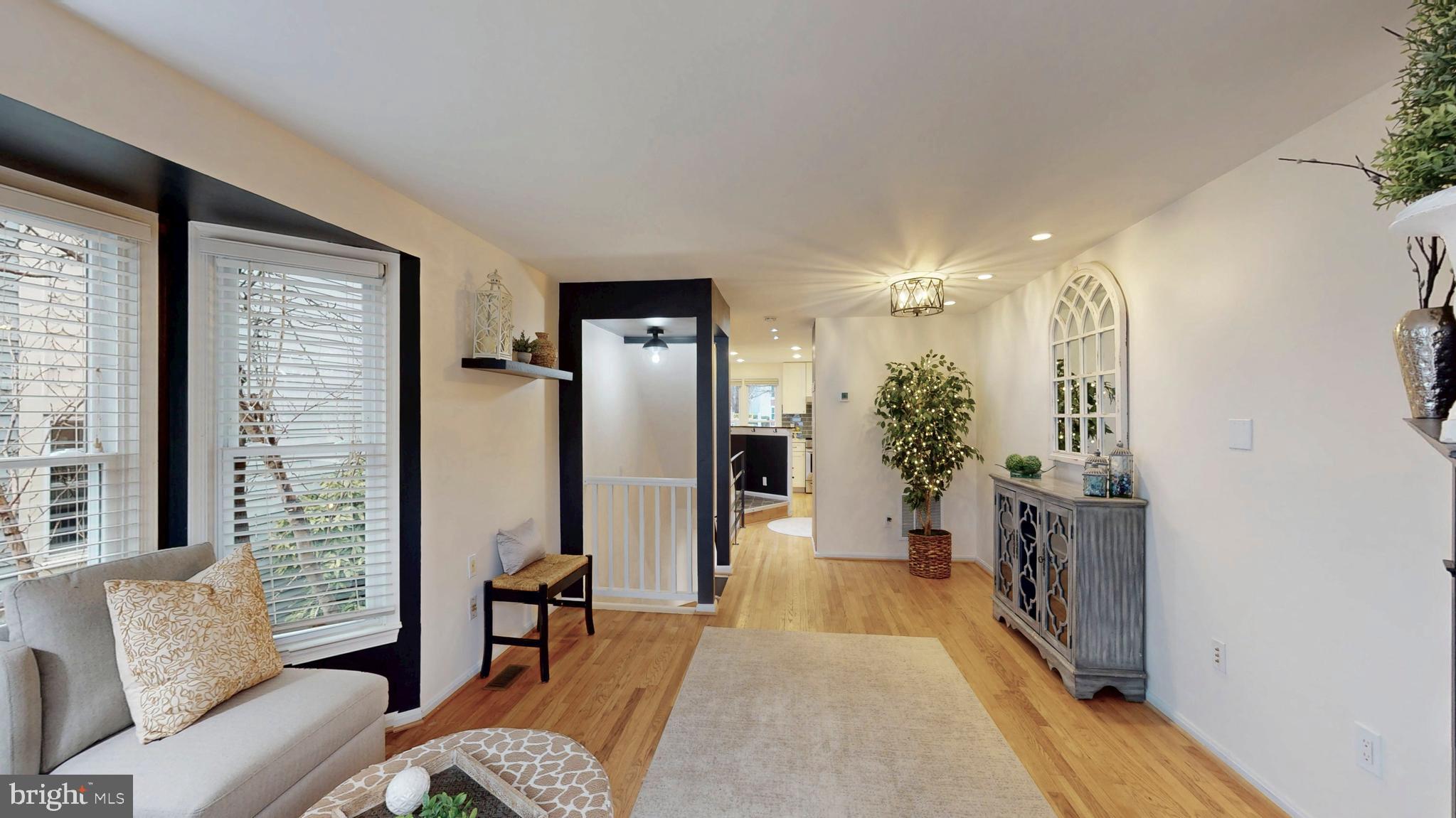 1771 Whisperhill Drive Reston, VA 20194 - Photo 19 of 44 a living room with furniture and a fireplace