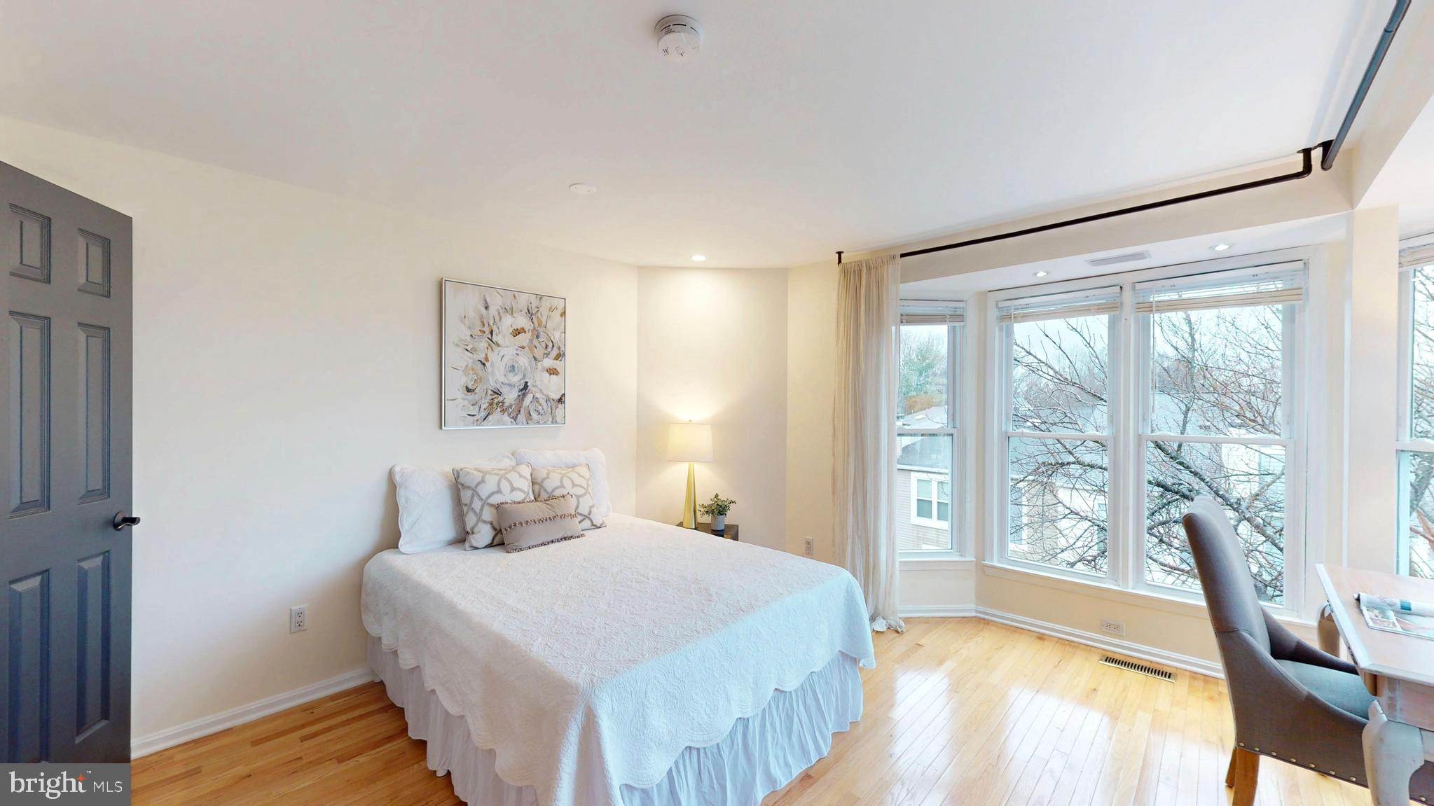 1771 Whisperhill Drive Reston, VA 20194 - Photo 21 of 44 a bedroom with a large bed and a large window