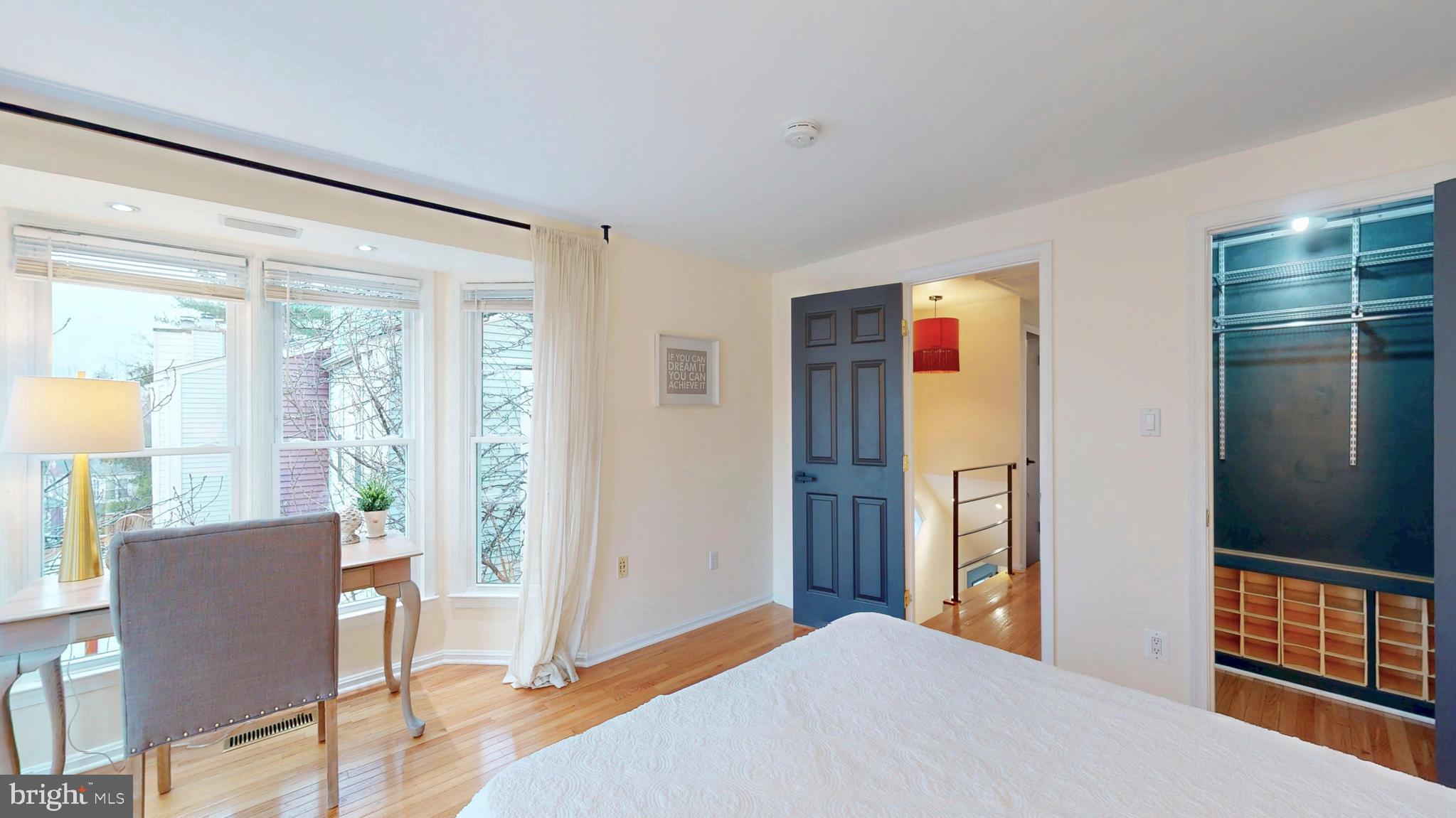 1771 Whisperhill Drive Reston, VA 20194 - Photo 23 of 44 a bedroom with a bed and wooden floor